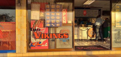 Two Vikings outside